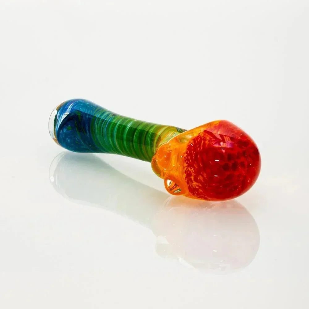 Colorful glass rainbow frit honeycomb spoon pipe on white background