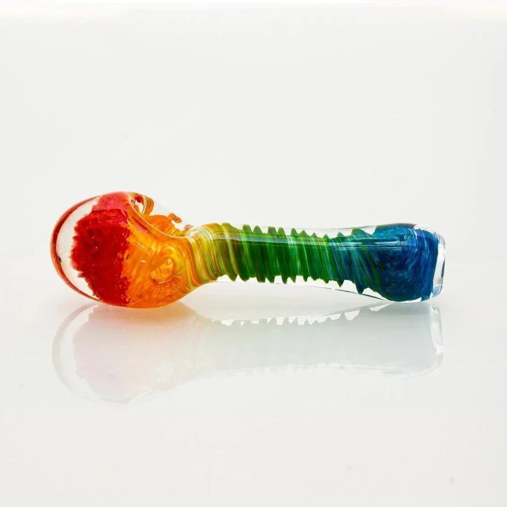 Colorful rainbow glass honeycomb spoon pipe with frit design on white background