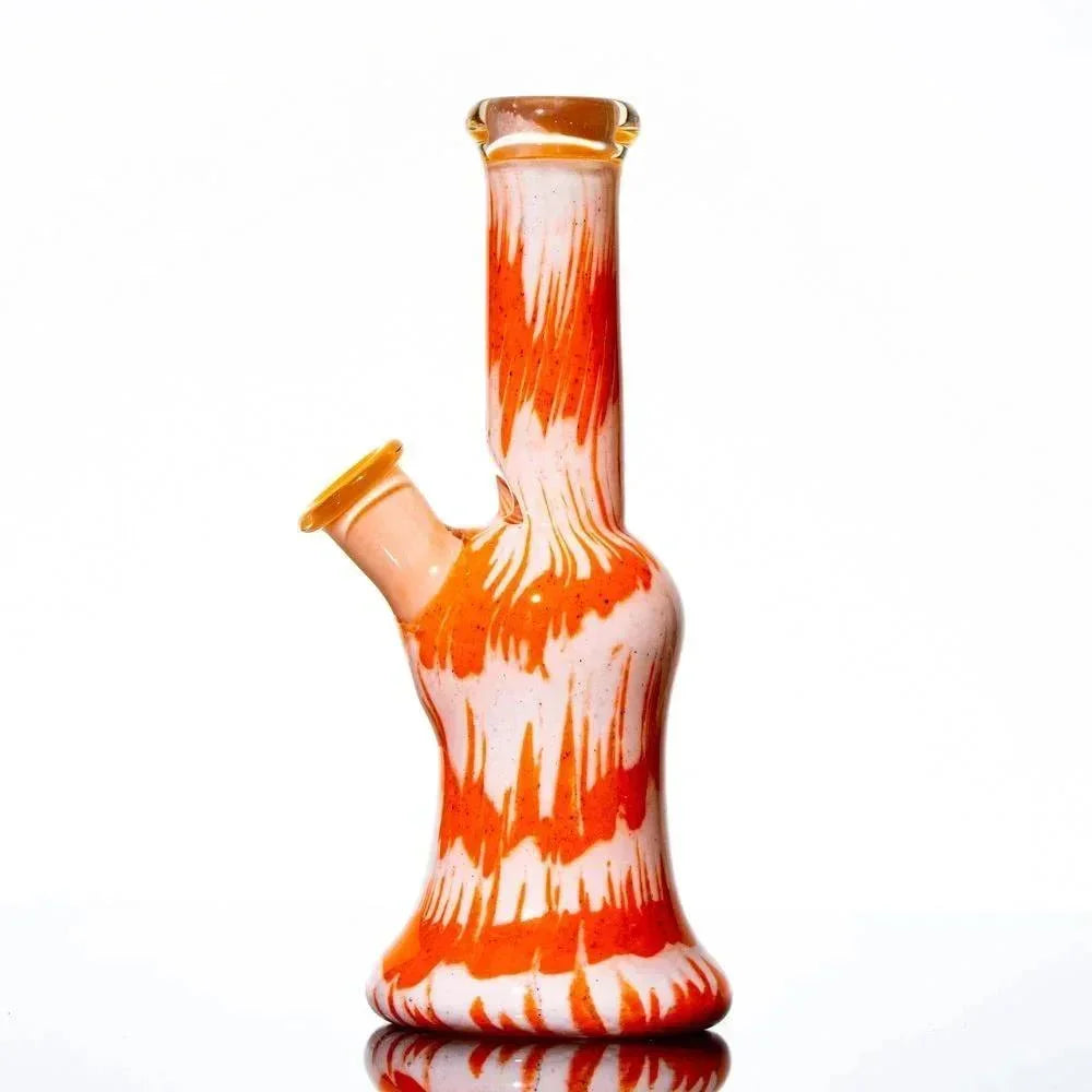 Orange and white frit glass water pipe with unique stacked tube design on white background