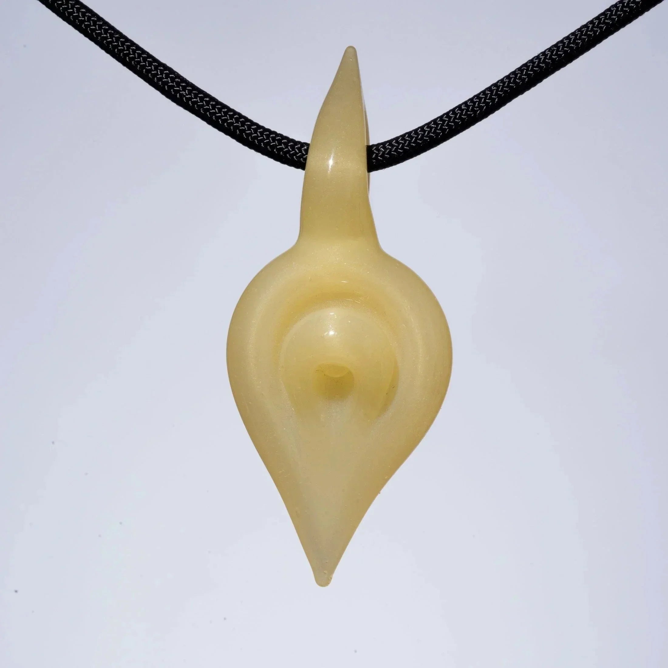 Handcrafted glass pendant with sleek, pointed design on black cord, ideal for heady glass collectors.