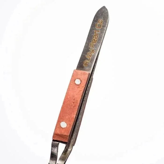 Ruby Pearl Co metal herb trimmer with copper handle, precision tool for cannabis prep