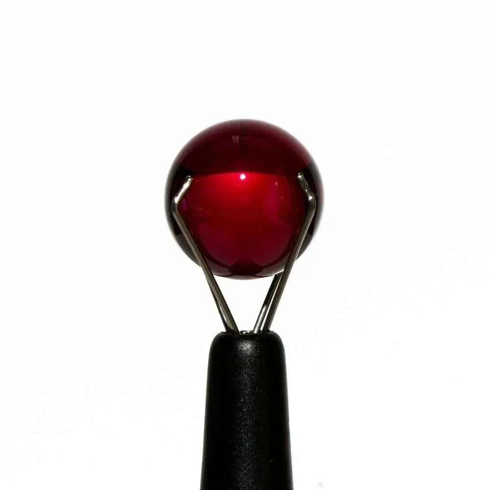 Red 10mm slurper guard glass ball on a holder for dab rig or quartz banger accessory