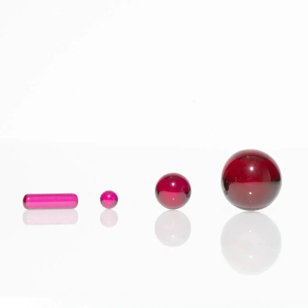 Ruby Mini Slurper set with three ruby marbles and a terp pearl on white background
