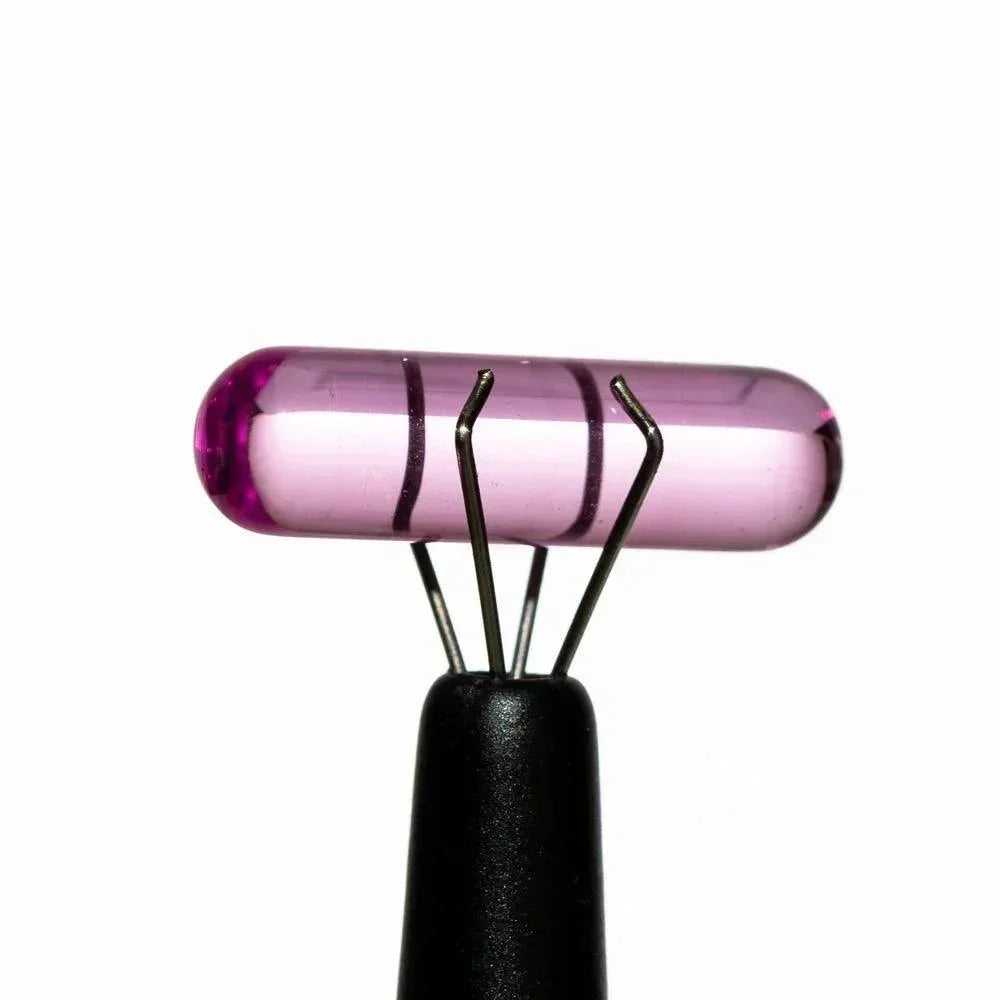 Purple glass pillar carb cap accessory for dab rig on white background