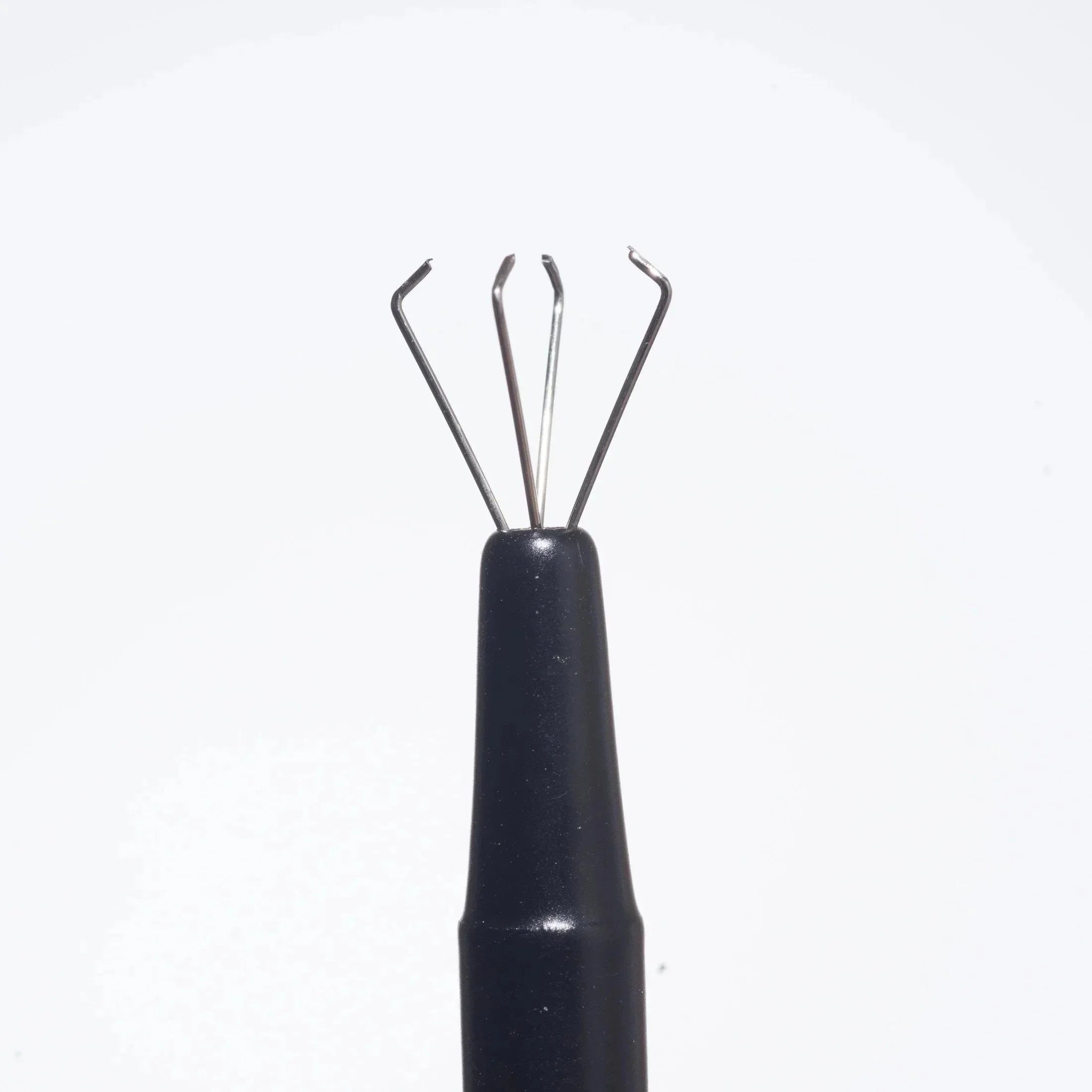 Metal claw grabber tool with black handle for picking up small smoking accessories