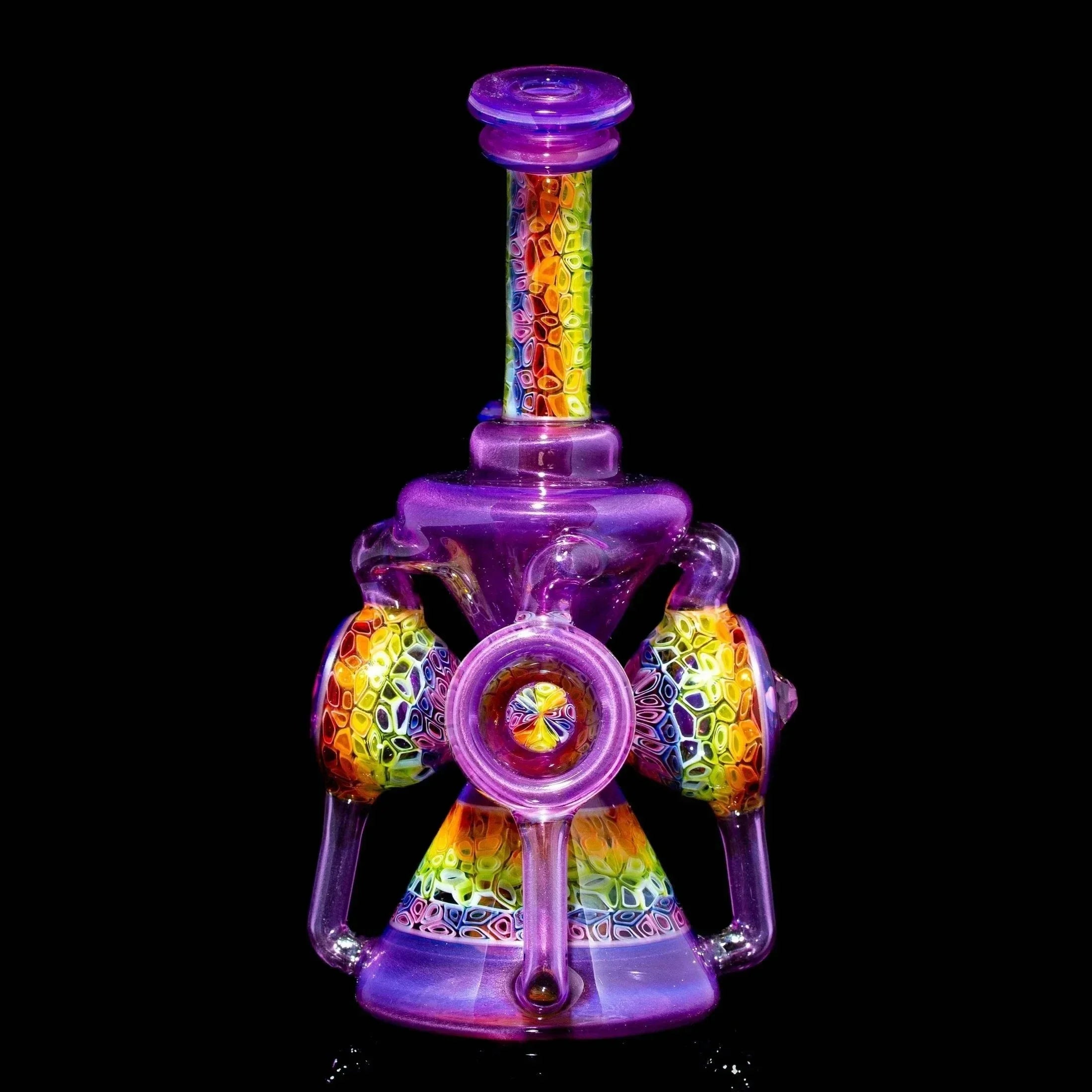 Colorful heady glass water pipe with intricate rainbow and purple patterns on black background