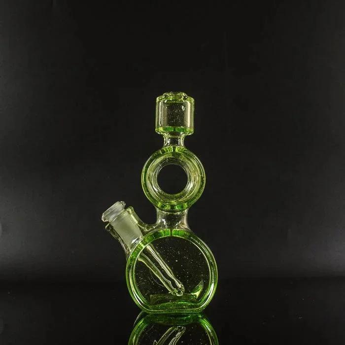Green glass bong with circular design and stem, ideal for heady glass collectors