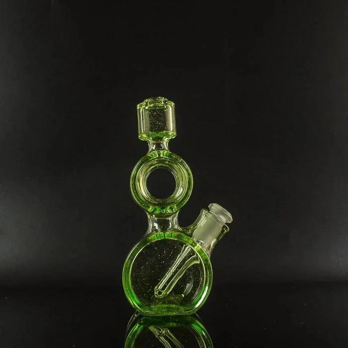 Green glass bong with circular design and reflective surface