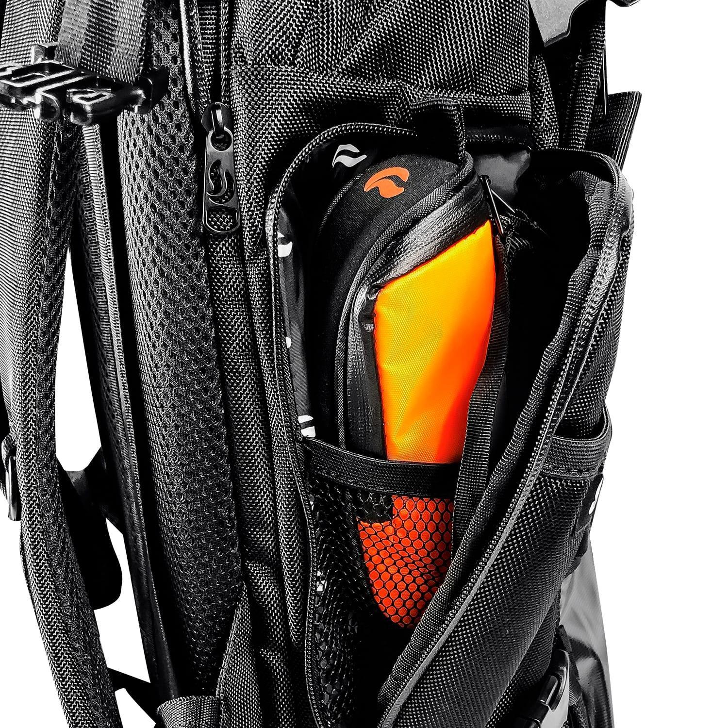 Close-up of a backpack side pocket with orange pouch and black mesh organizer