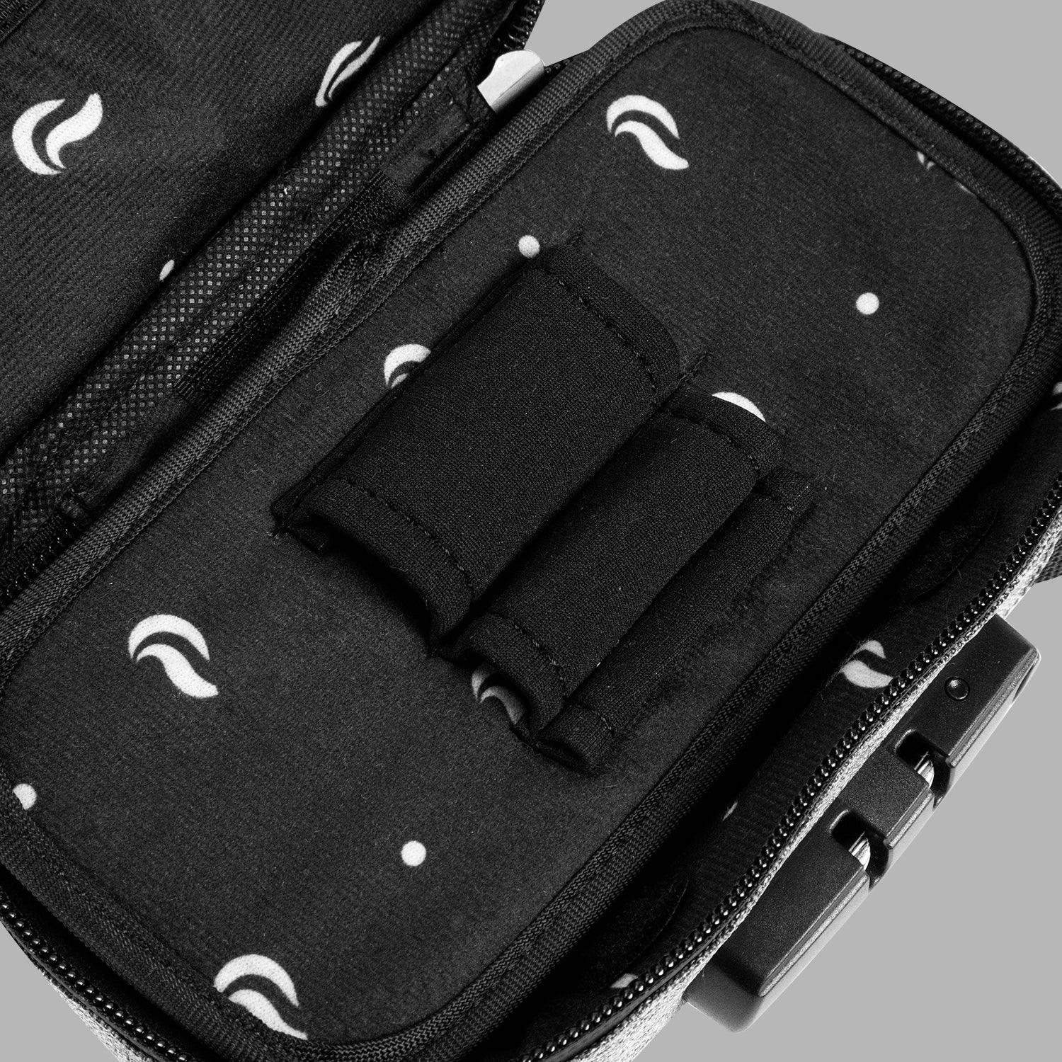 Open smell-proof bag with lock, padded black interior and elastic tool holders