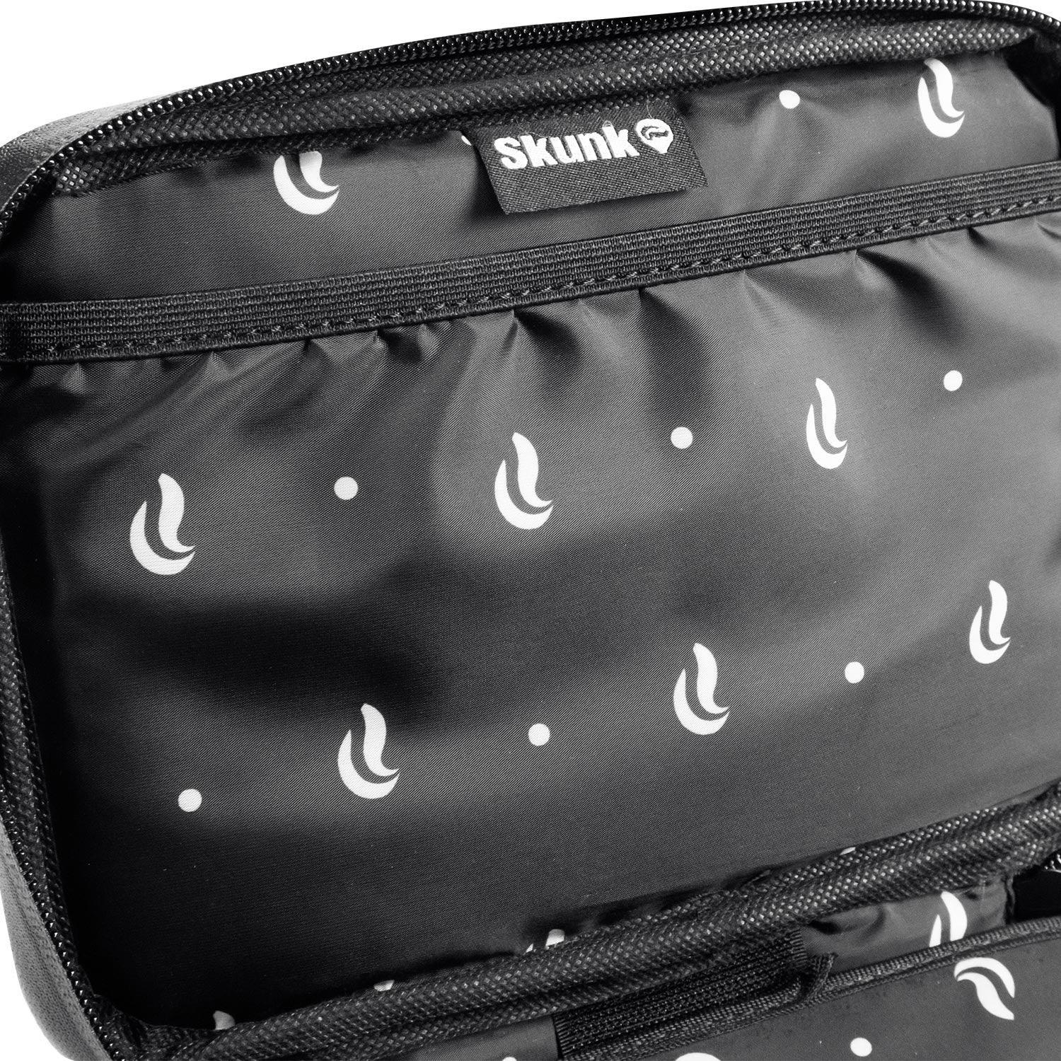 Close-up of black Skunk branded storage pouch with white pattern and zipper compartment