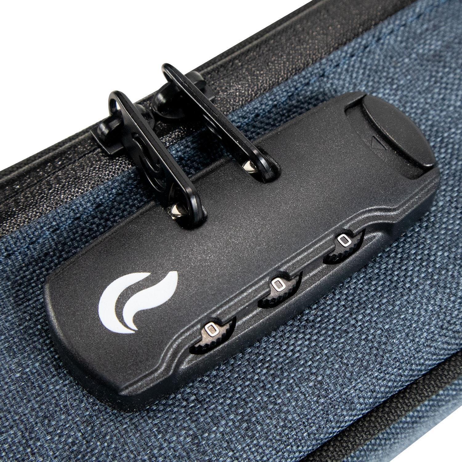 Close-up of a smell proof bag with combination lock and black zipper on blue fabric