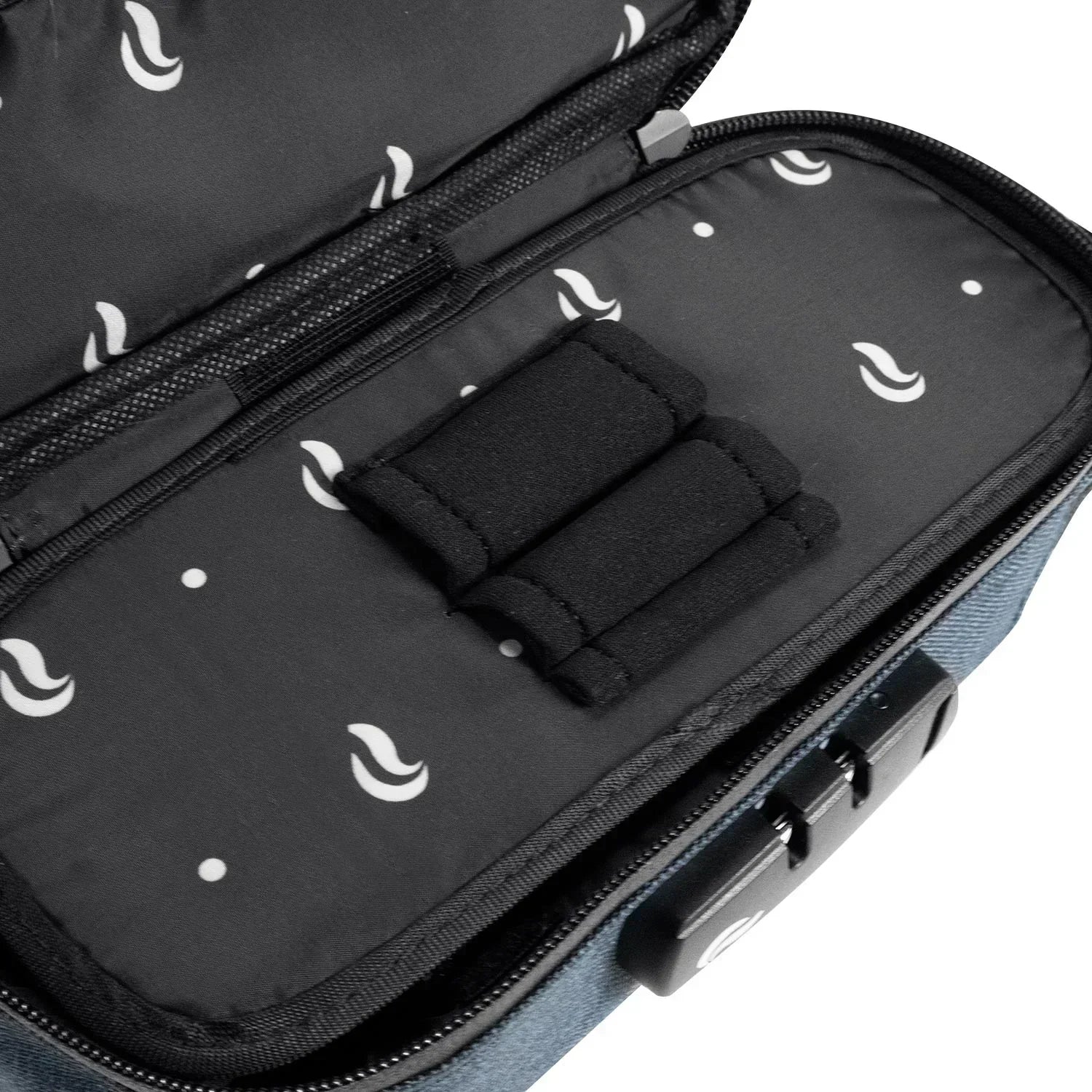 Closeup of padded, lockable storage case interior with elastic holders and printed lining.