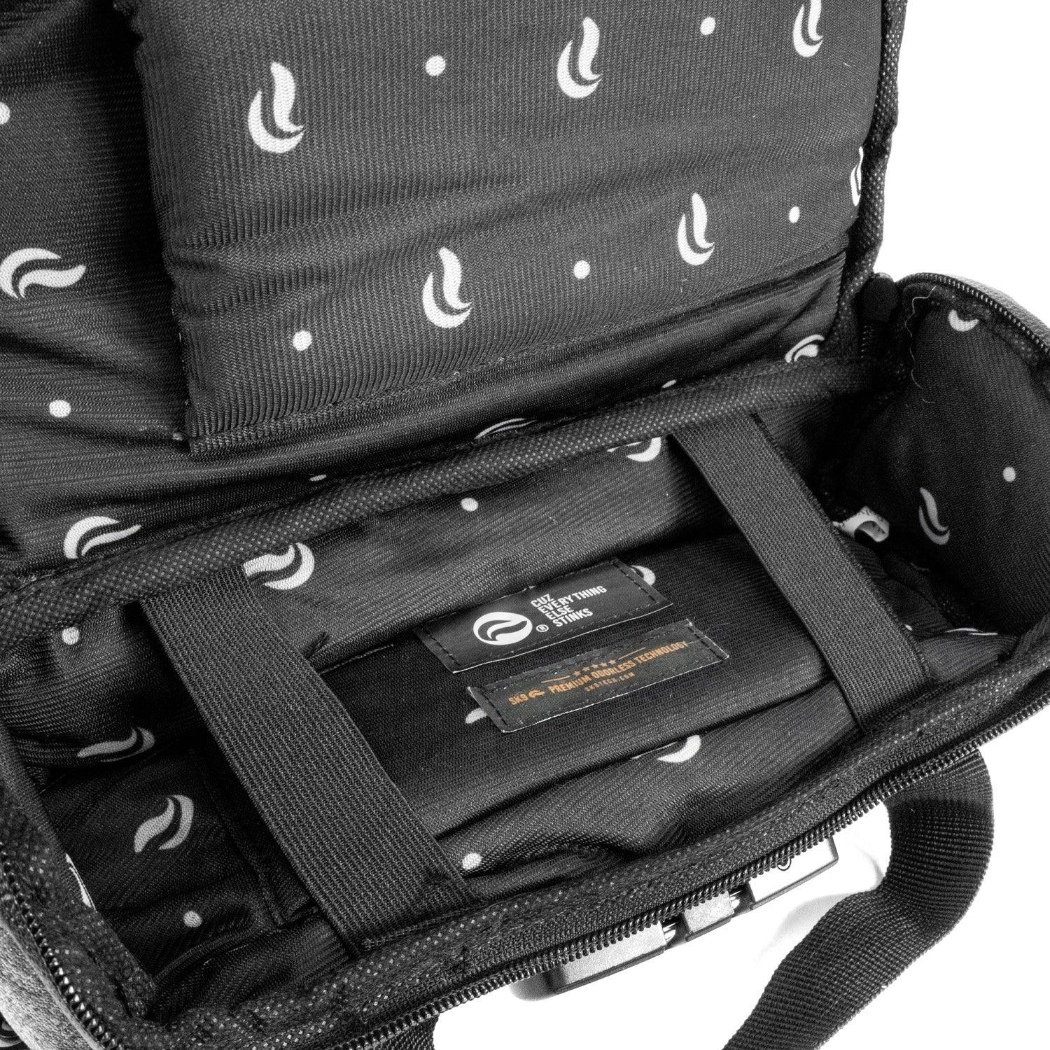 Close-up of black duffle bag interior with padded lining and small logo pattern