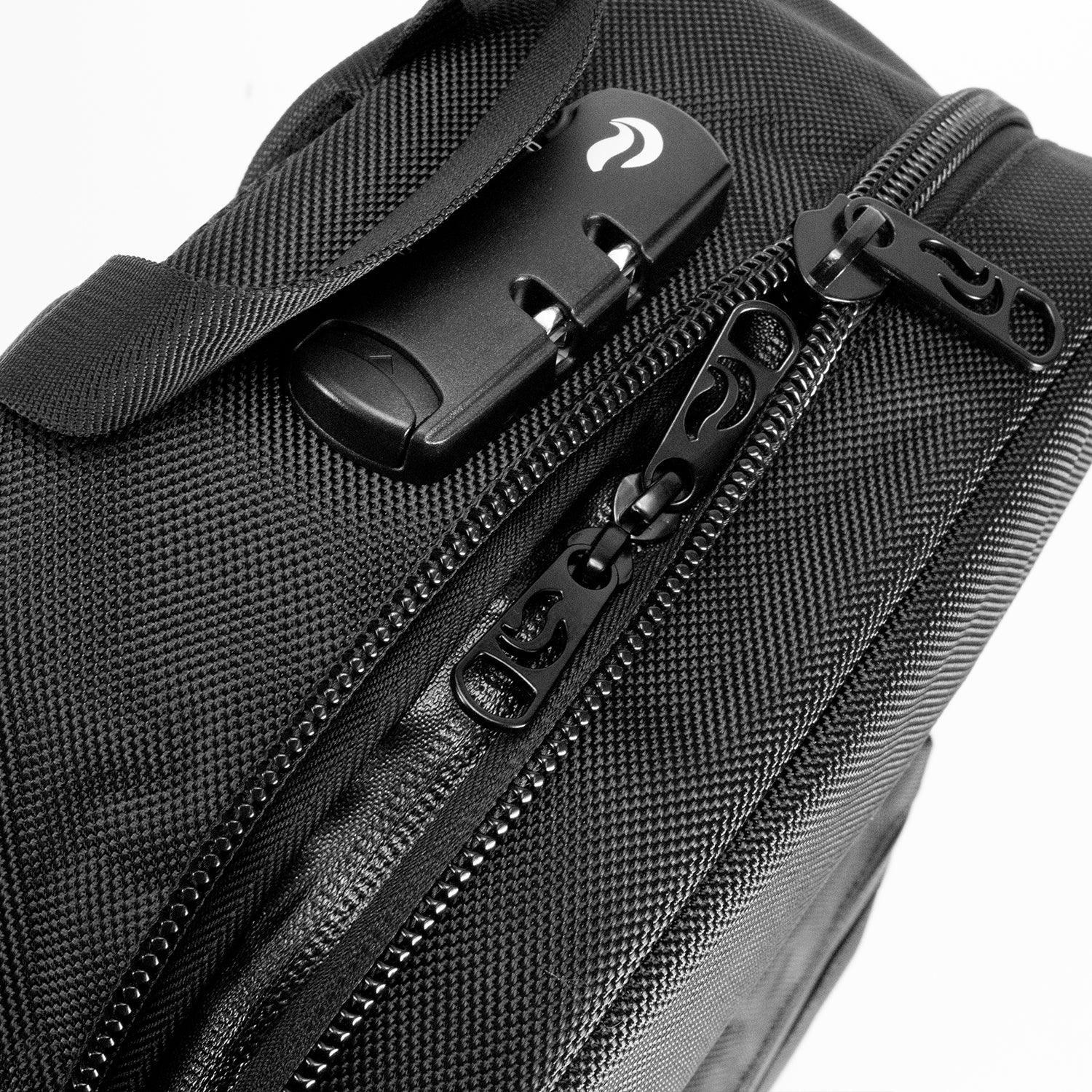 Black odor-proof bag with double zippers and locking mechanism, close-up view.