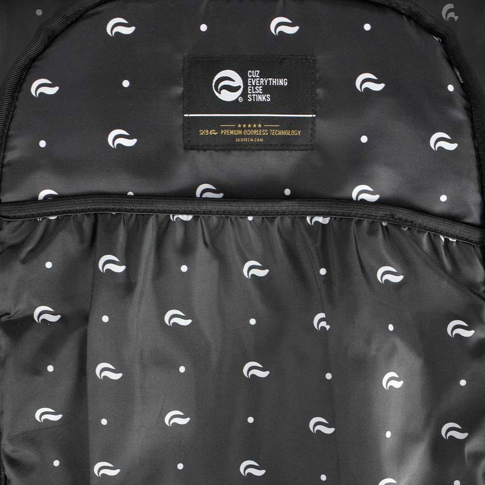 Black backpack interior with small white pattern, built-in label and inner pocket shown