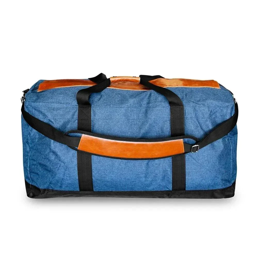 Blue denim duffle bag with brown leather accents and black straps, rear view
