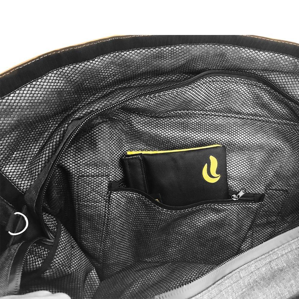 Interior mesh pocket of odor-proof bag with black and yellow pouch inside