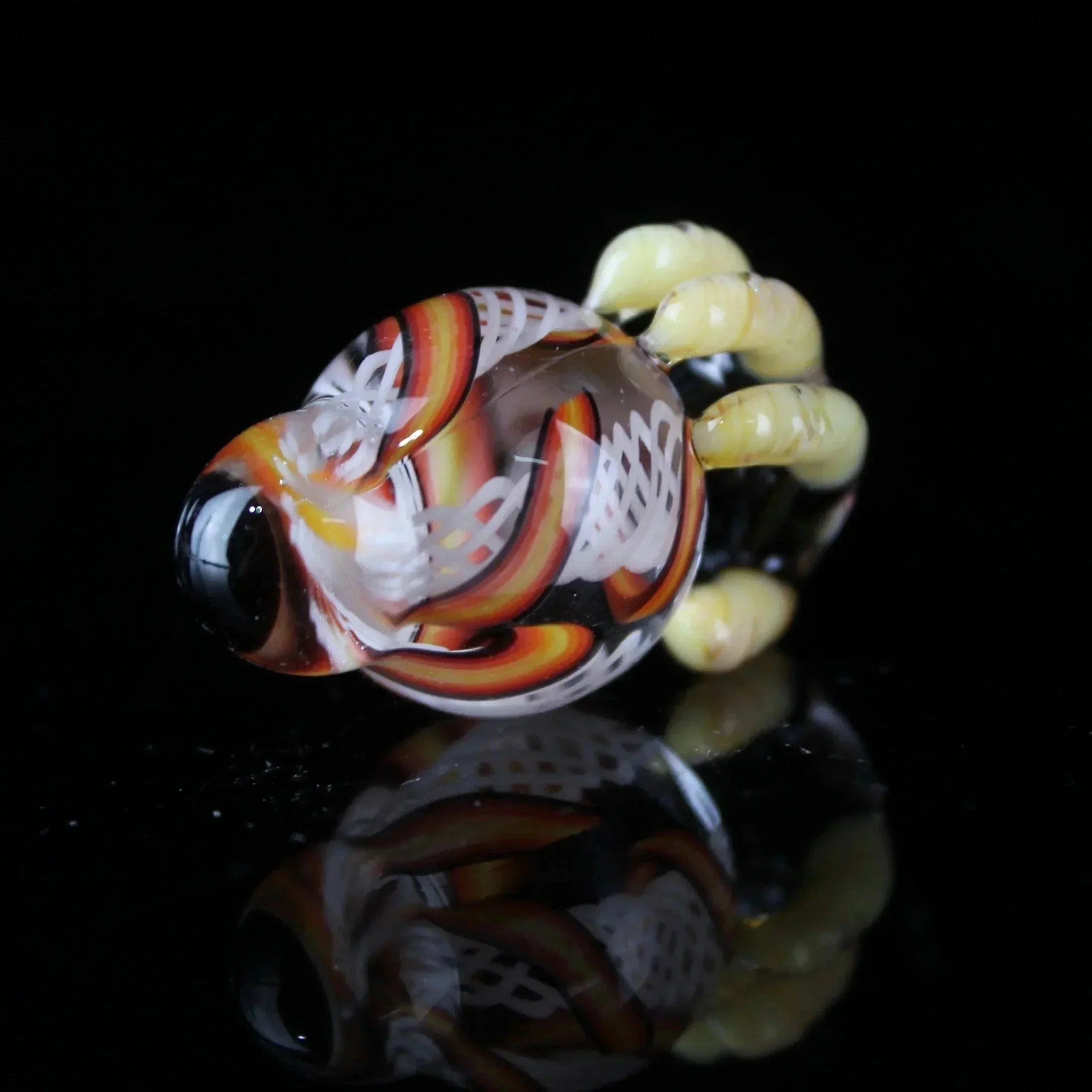 Hand-blown glass carb cap with fine line lattice and desert night swirl design on black background
