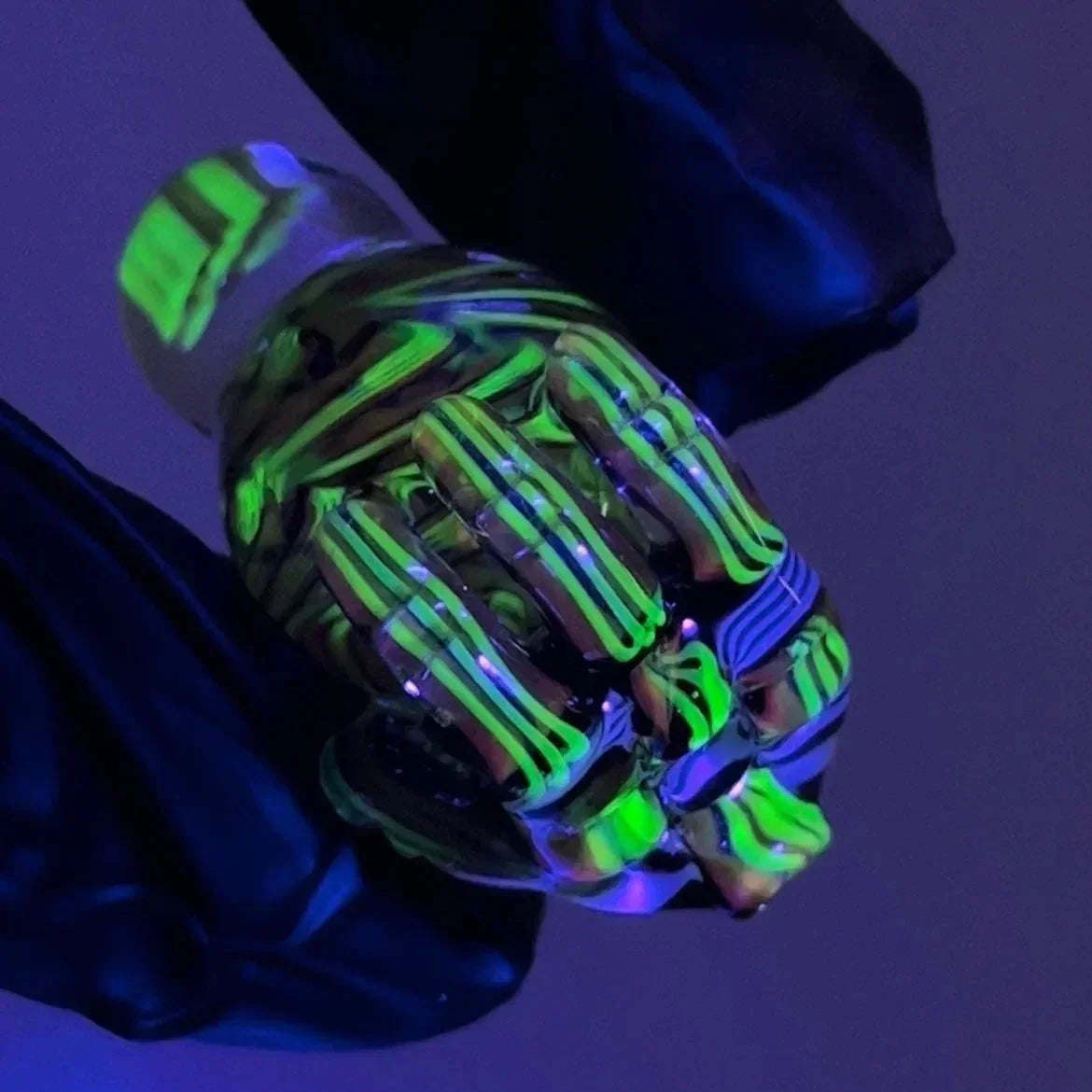 UV reactive glass smoking accessory with green and yellow chip weave pattern