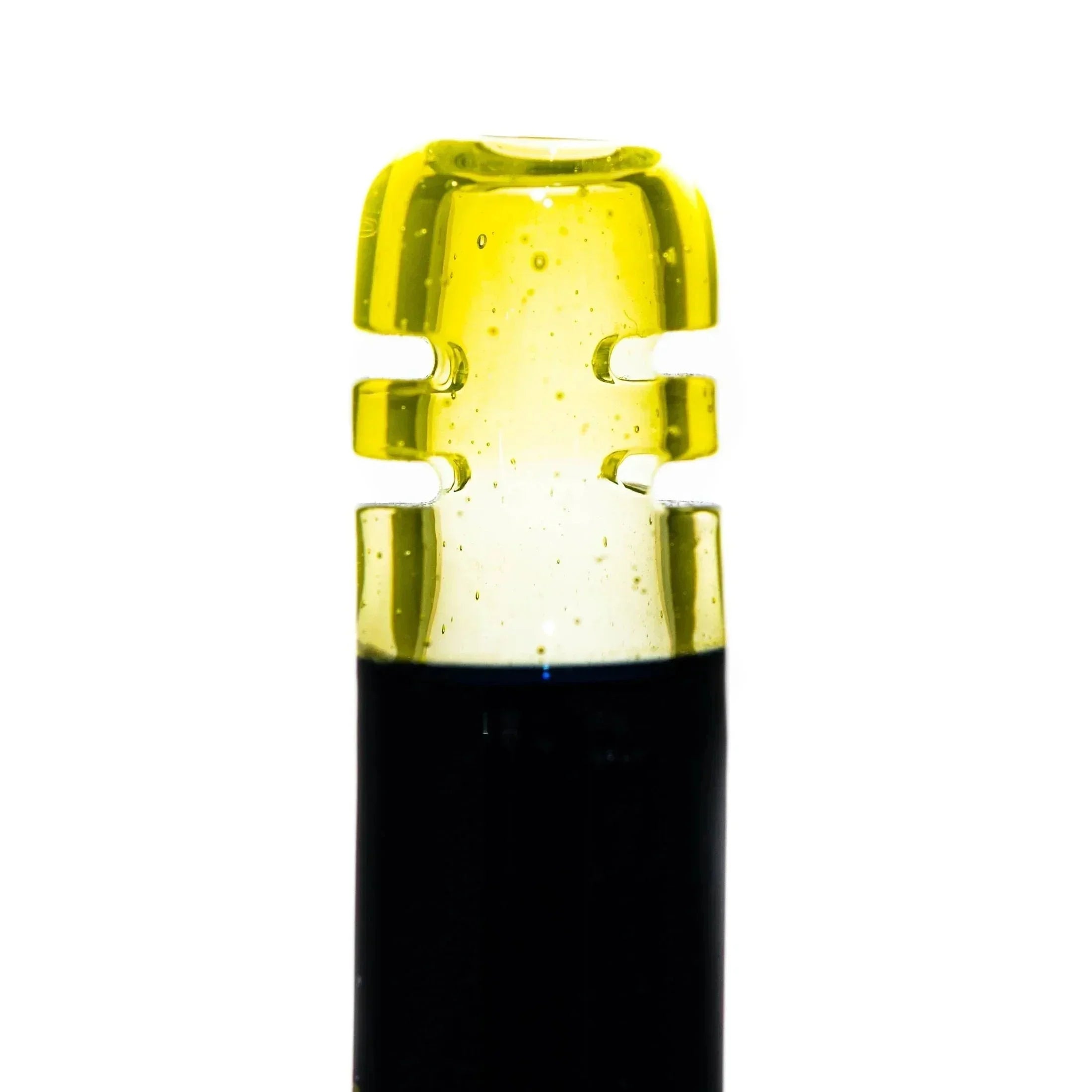 Black and yellow glass mouthpiece with notched design, photographed on white background