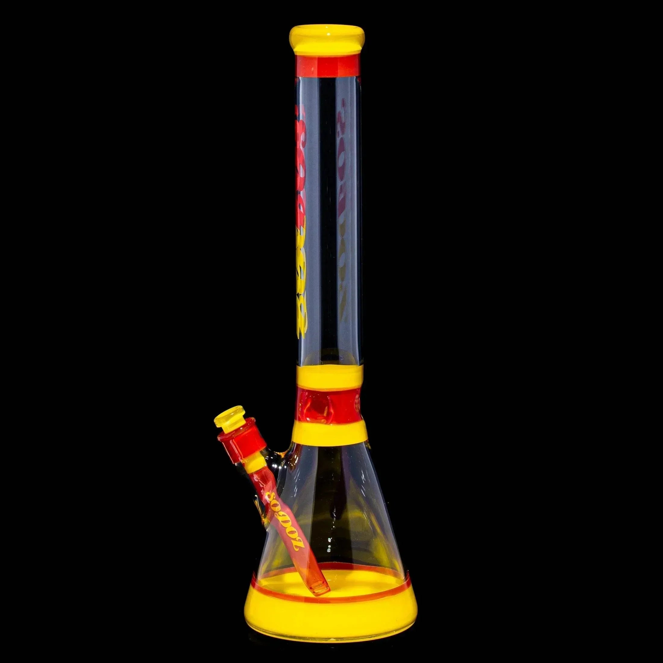 Red and yellow glass beaker bong with downstem, straight neck, and flared base on black background