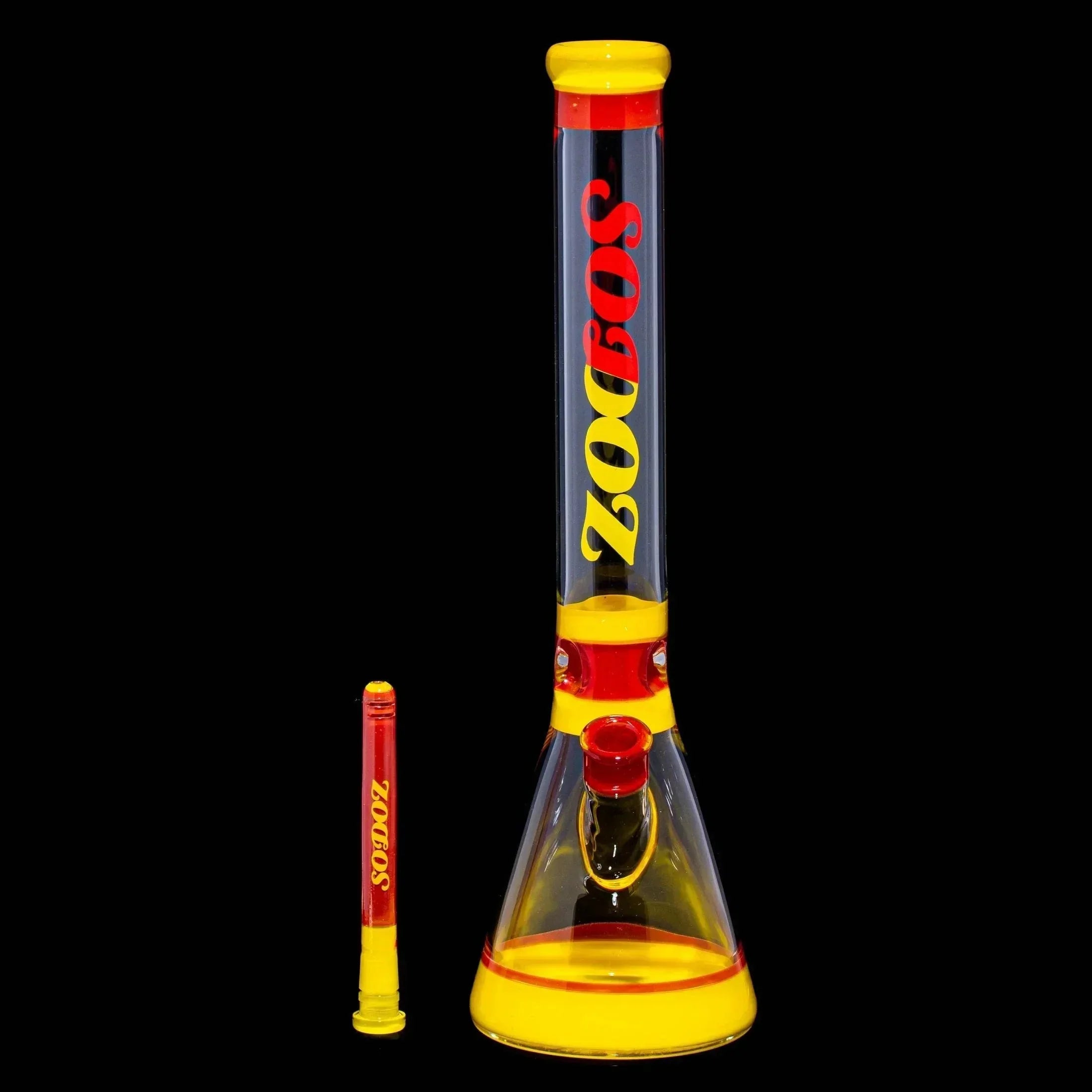 Yellow and red glass beaker bong with SODOZ text, and matching downstem on black background.
