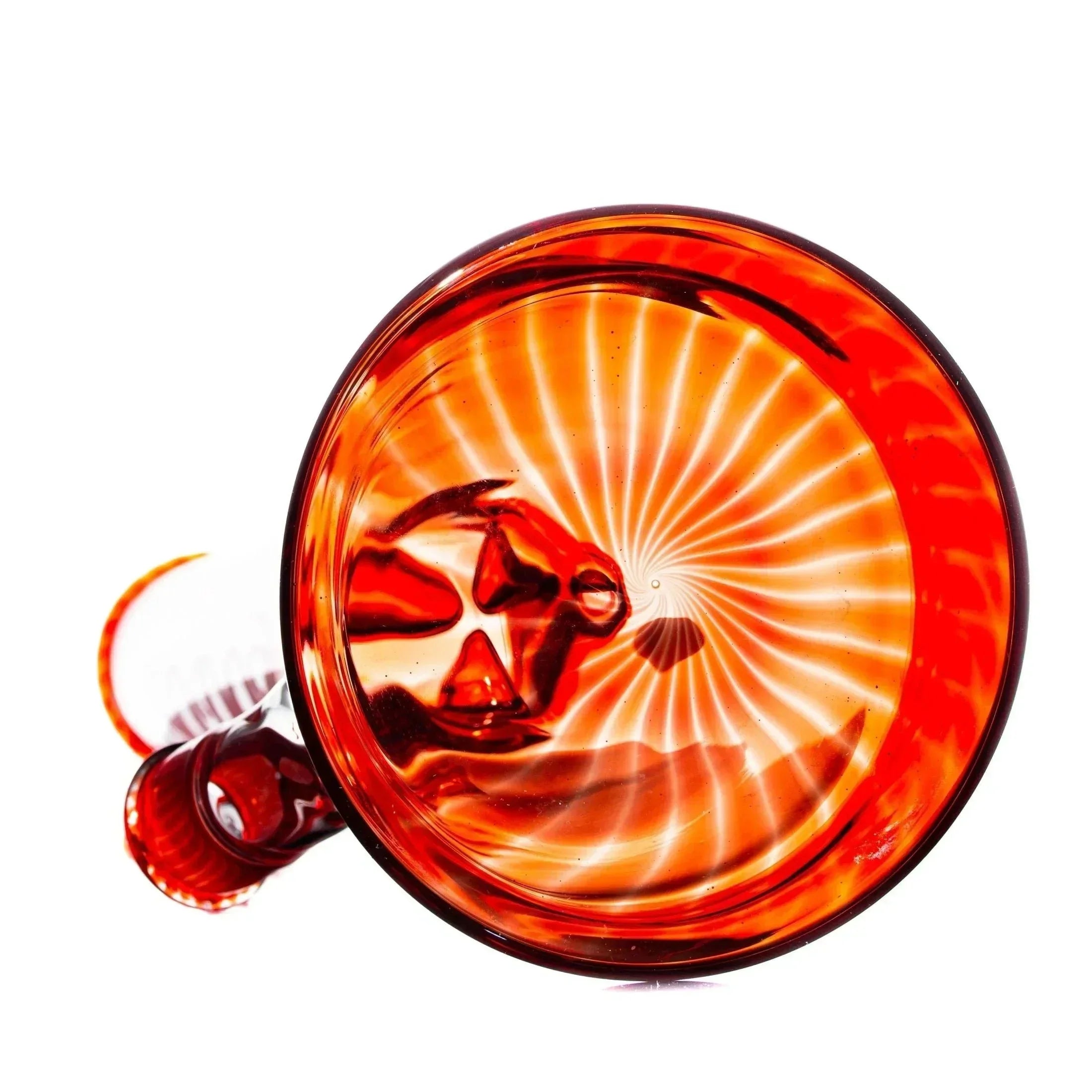 Red glass water pipe with spiral pattern, viewed from above on white background