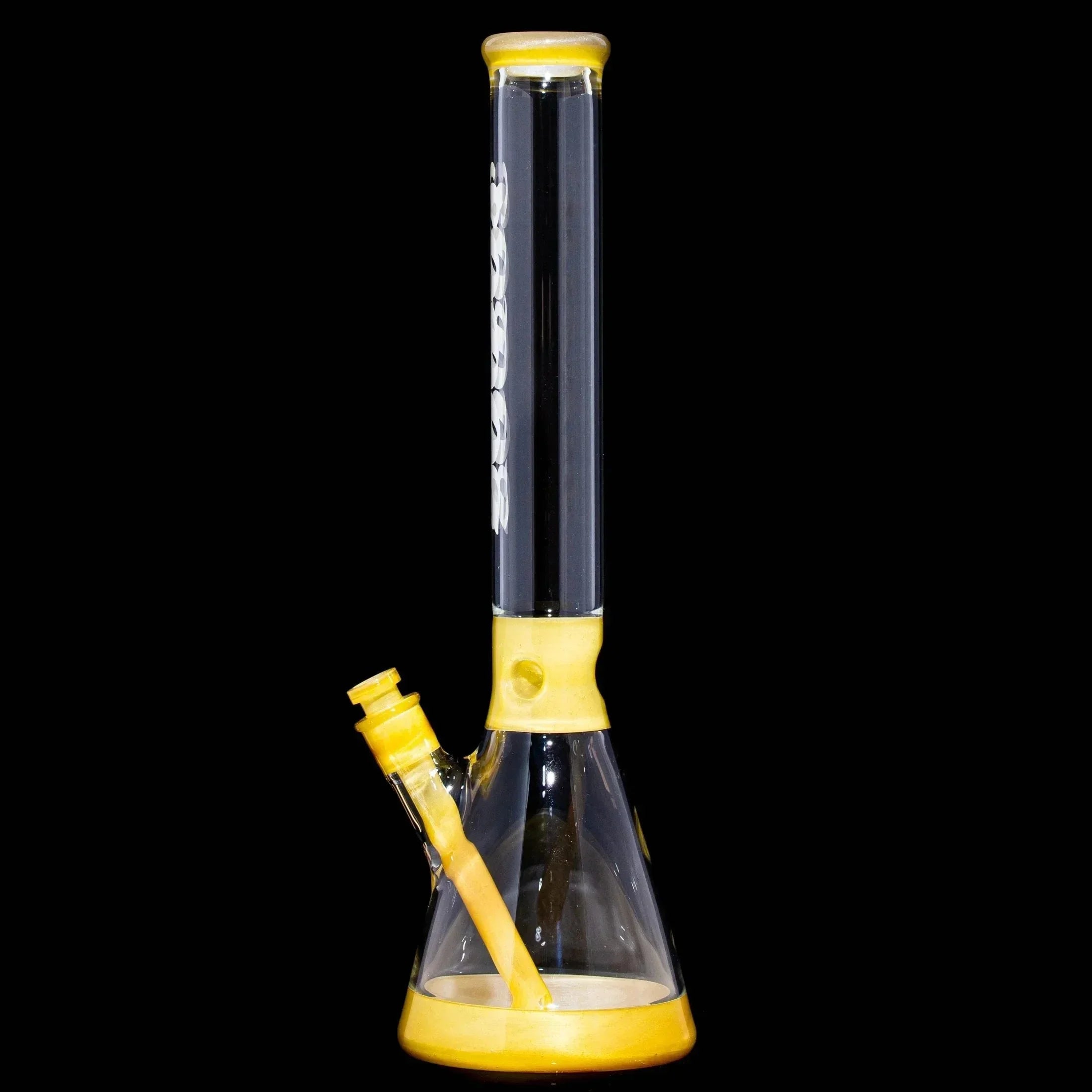 Clear and peach yellow beaker glass water pipe with downstem on black background
