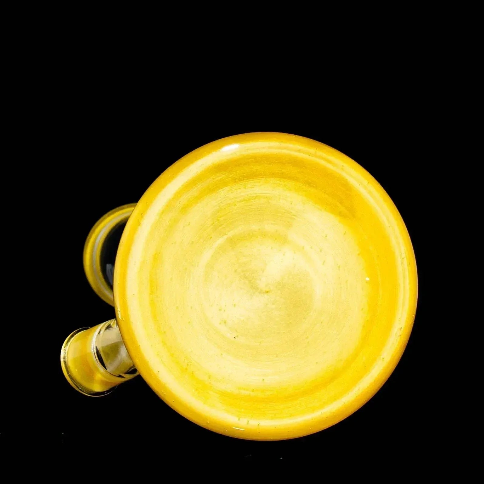 Peach yellow glass smoking pipe with a satin finish on a black background