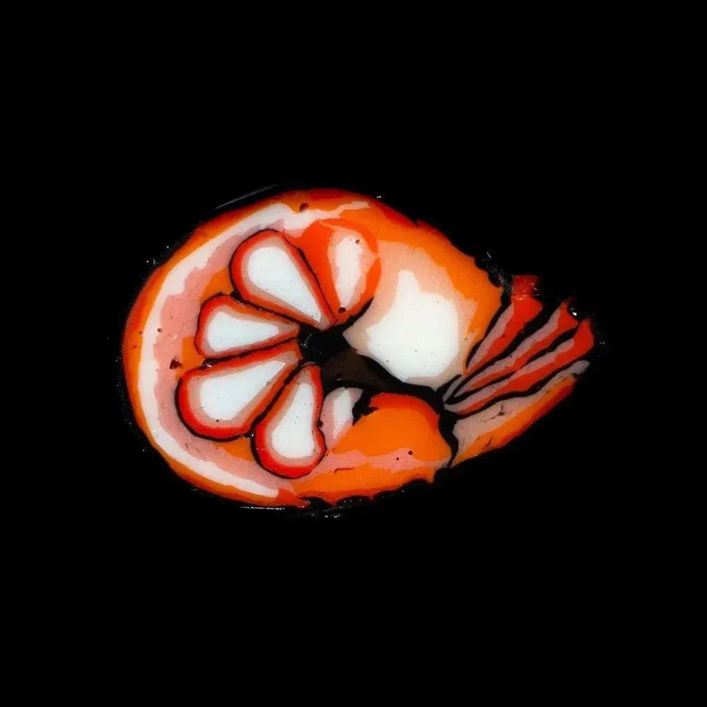 Handcrafted glass shrimp coin with vibrant orange, white, and red details on black background