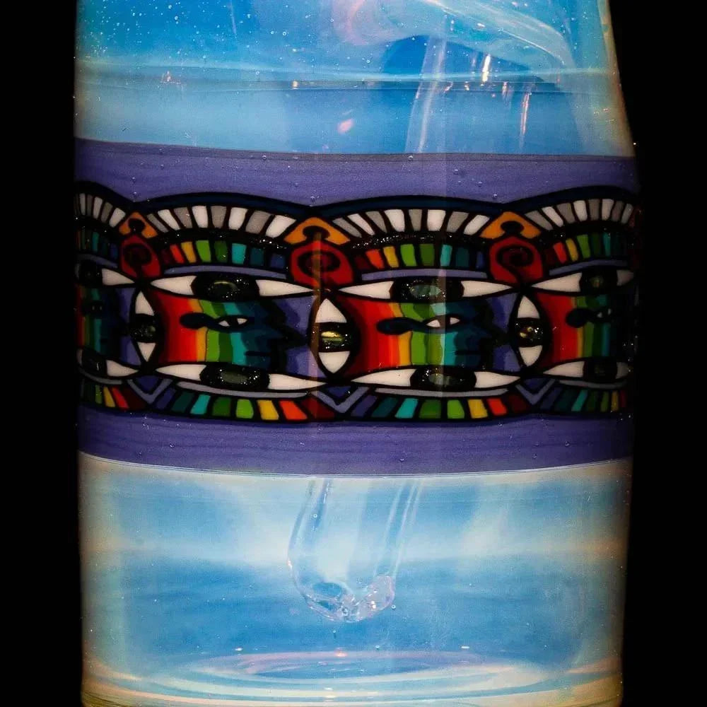 Colorful patterned glass water pipe detail with vibrant geometric band and clear chamber