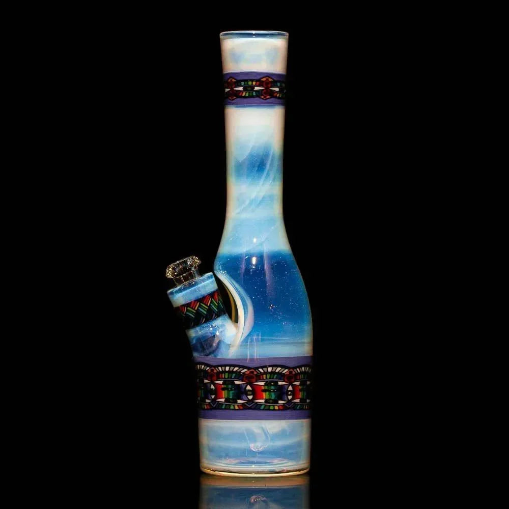 Hand-blown blue glass water pipe with intricate pattern accents on a black background