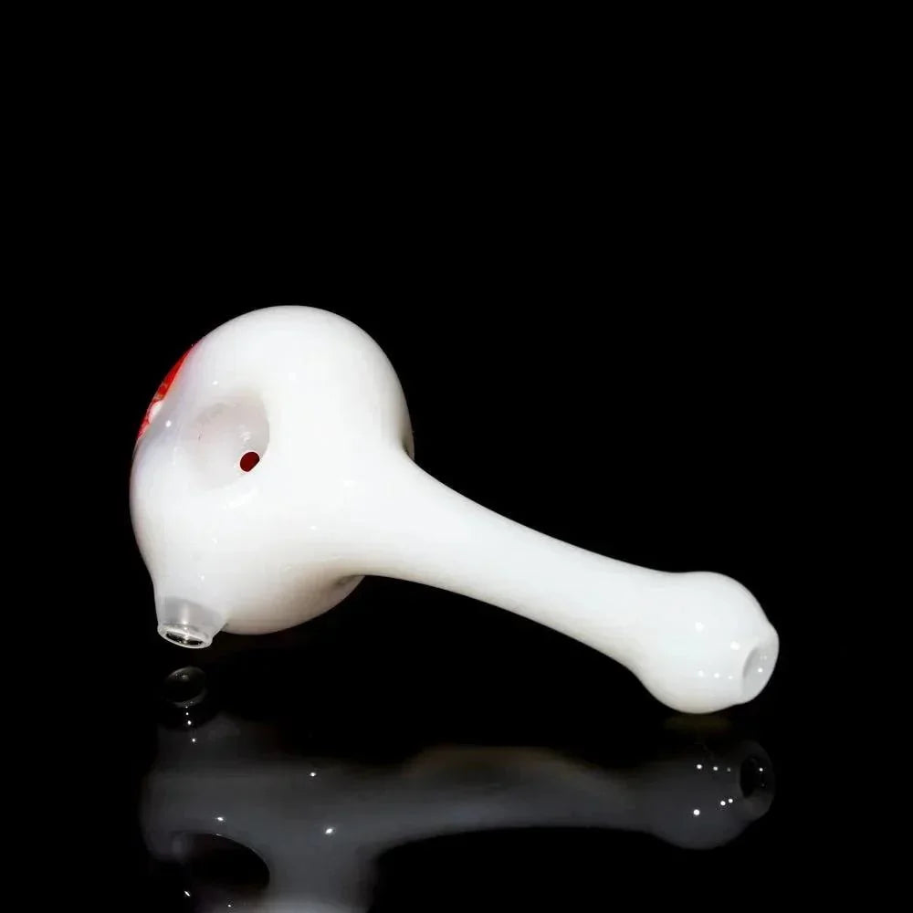 White glass hand pipe with a rounded bowl and elongated stem on a black background