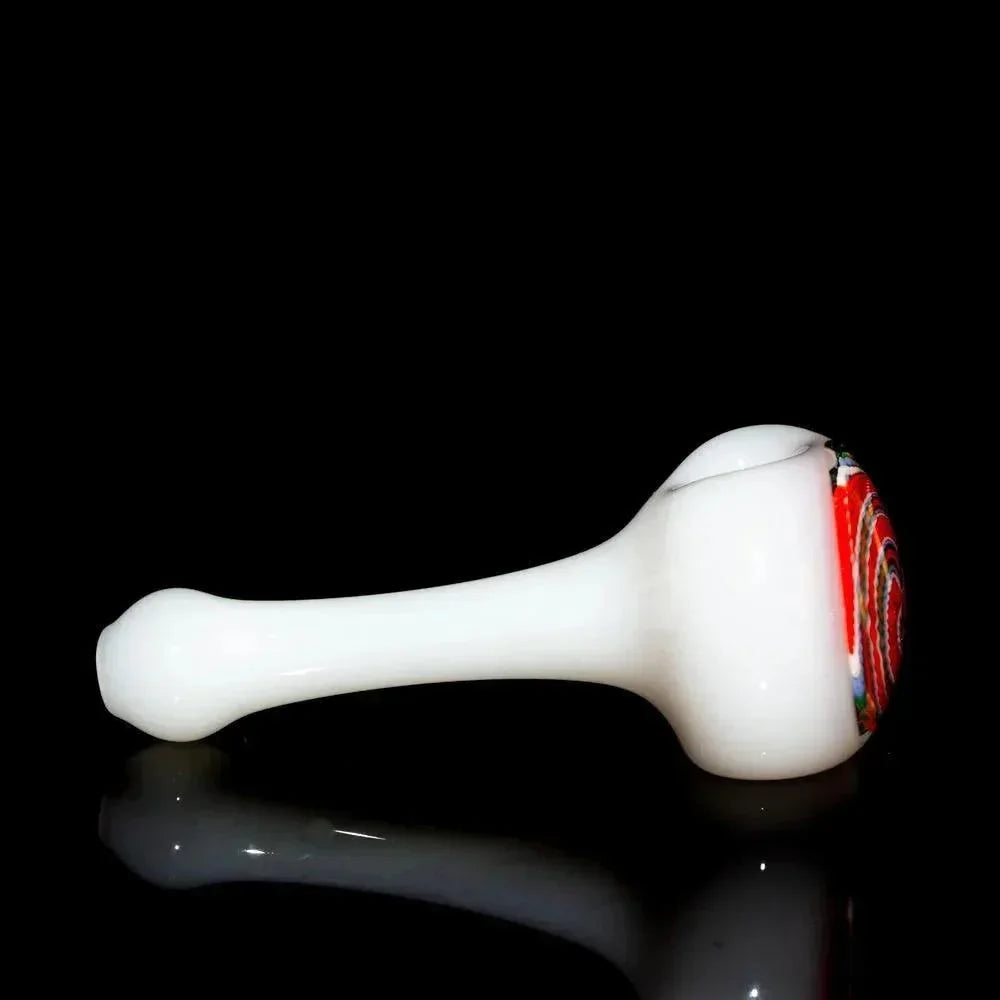 White glass spoon pipe with orange, blue, and white spiral design on bowl, displayed on black background