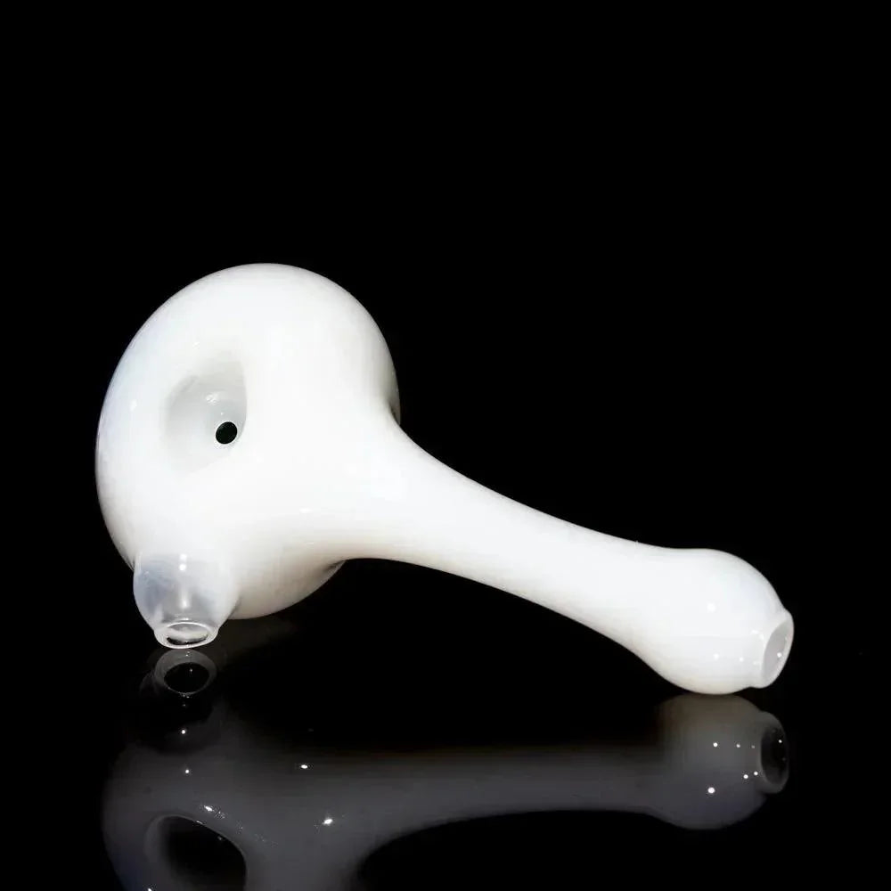 White glass hand pipe with round bowl and flat mouthpiece on black background