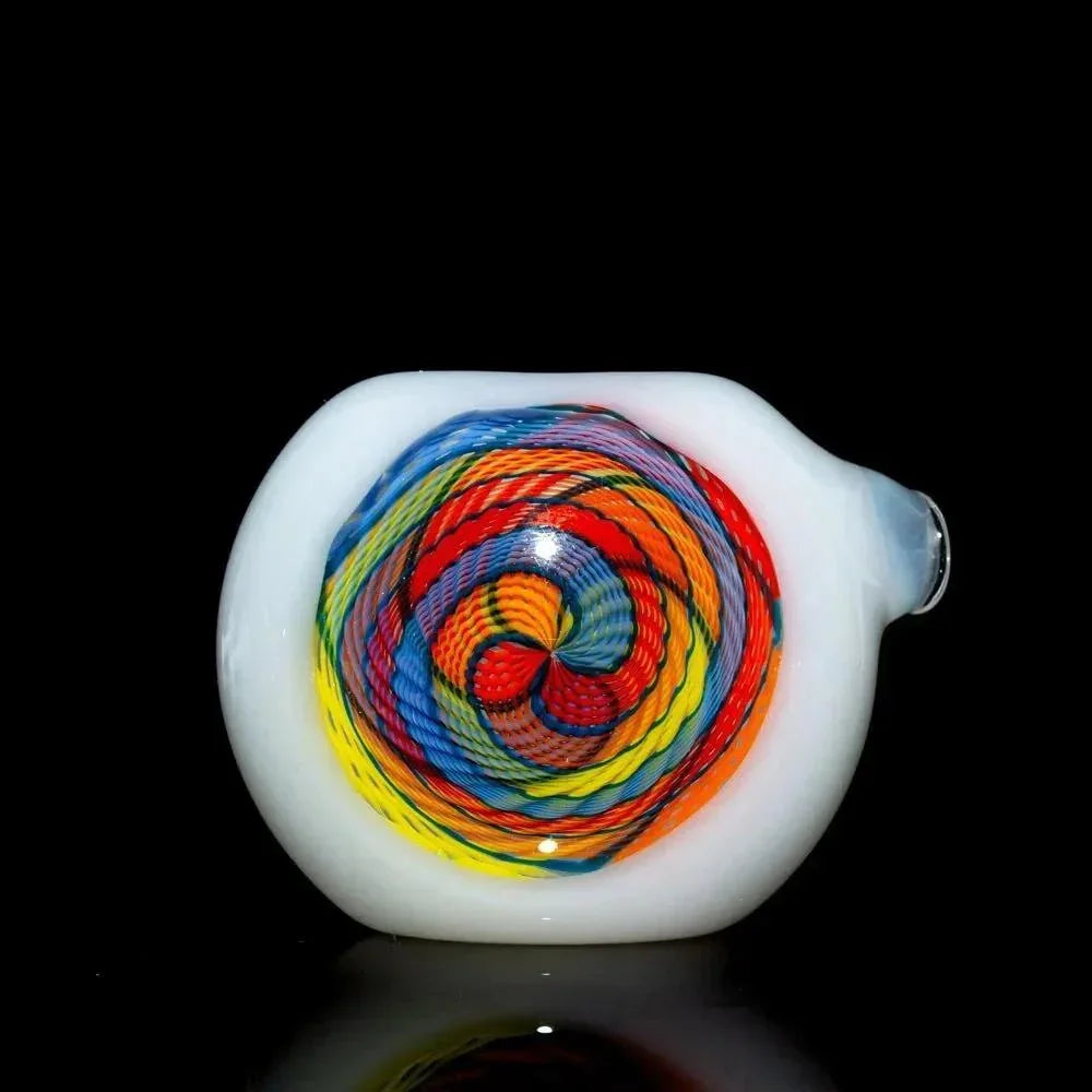 Colorful glass hand pipe with rainbow swirl pattern on white base, isolated on black background