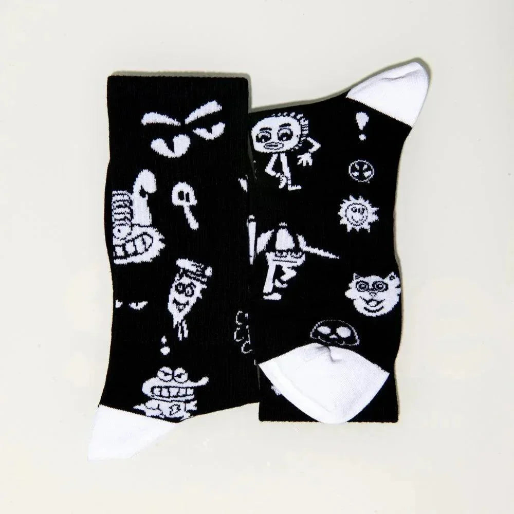 Black crew socks with white cartoon graphics and faces, white toe and heel accents