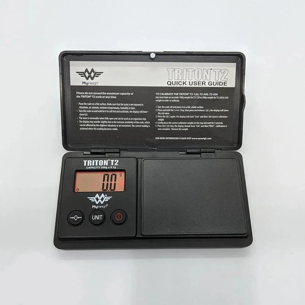 Triton T2 digital pocket scale with LCD display and user guide, 550g capacity.