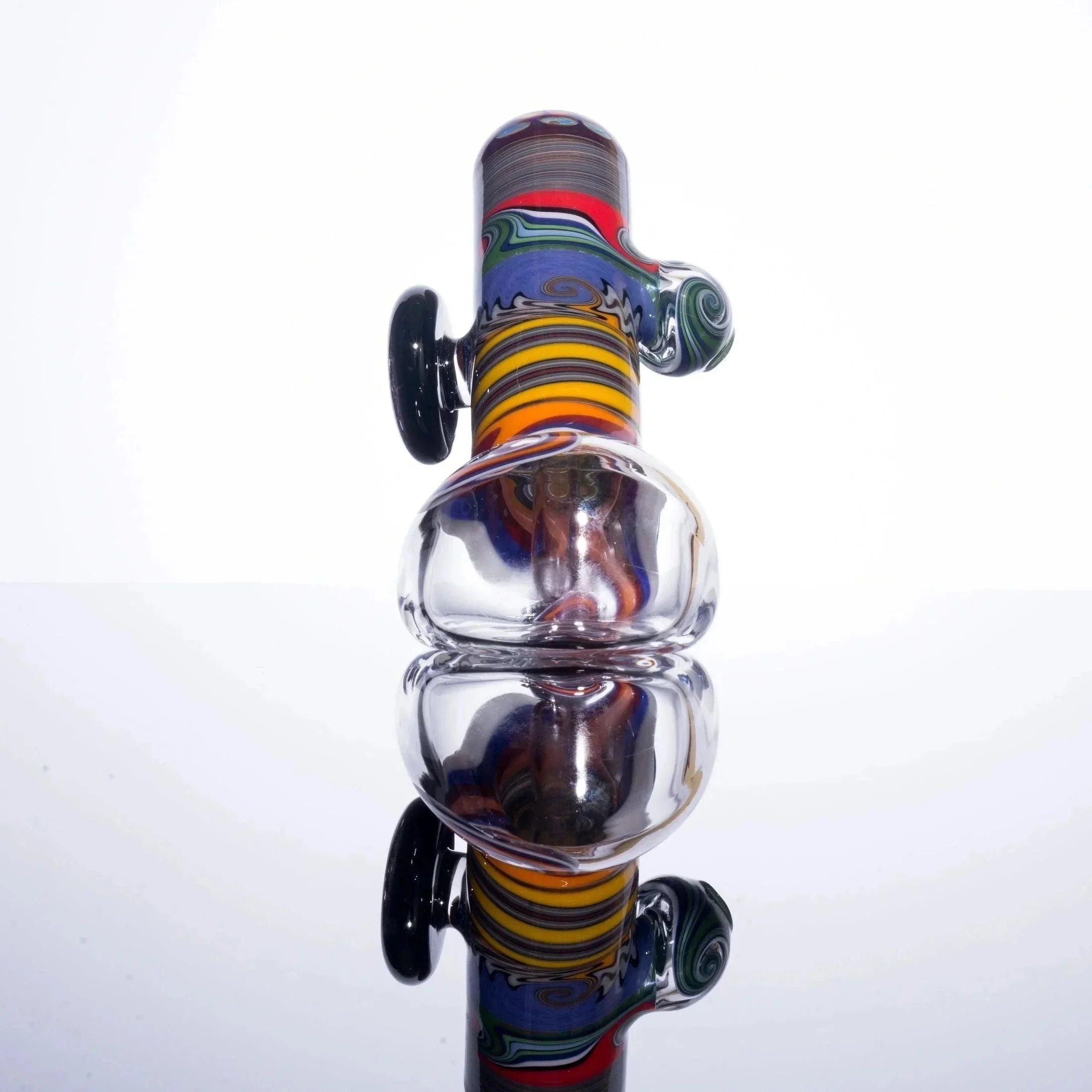 Colorful glass bubbler pipe with intricate swirls and clear chamber on white background