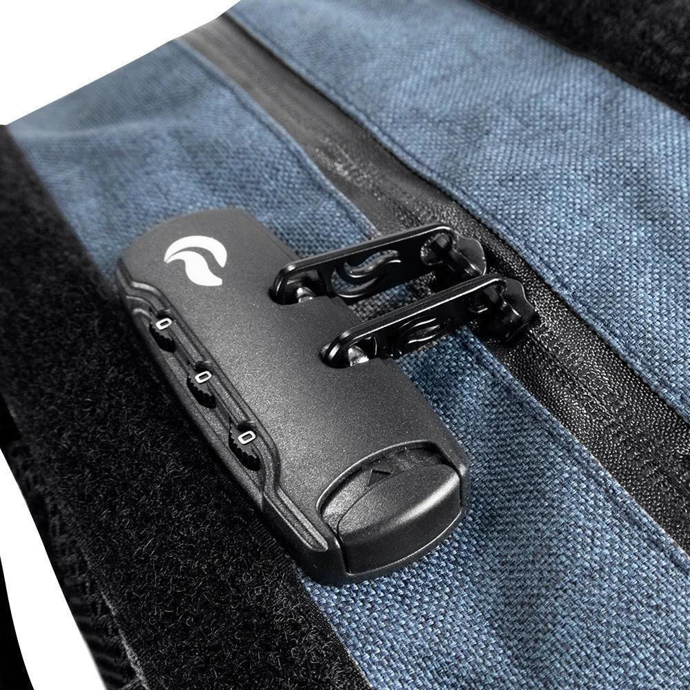 Close-up of a blue bag with combination zipper lock and black fabric detail