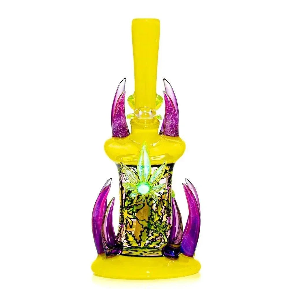 Colorful yellow and purple heady glass water pipe with intricate leaf design and artistic spikes.