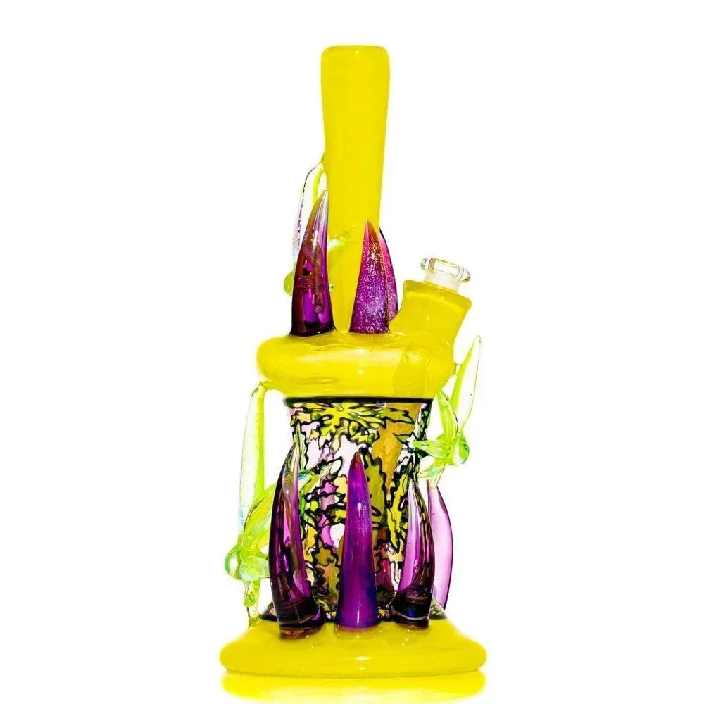 Artistic yellow and purple glass water pipe with colorful accents and intricate designs