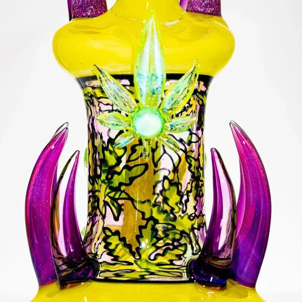 Colorful heady glass bong with yellow, purple accents and decorative leaf design