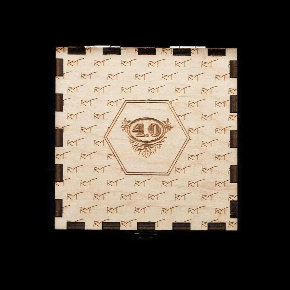 Engraved wooden box with '40' emblem and repetitive RT pattern on light wood background