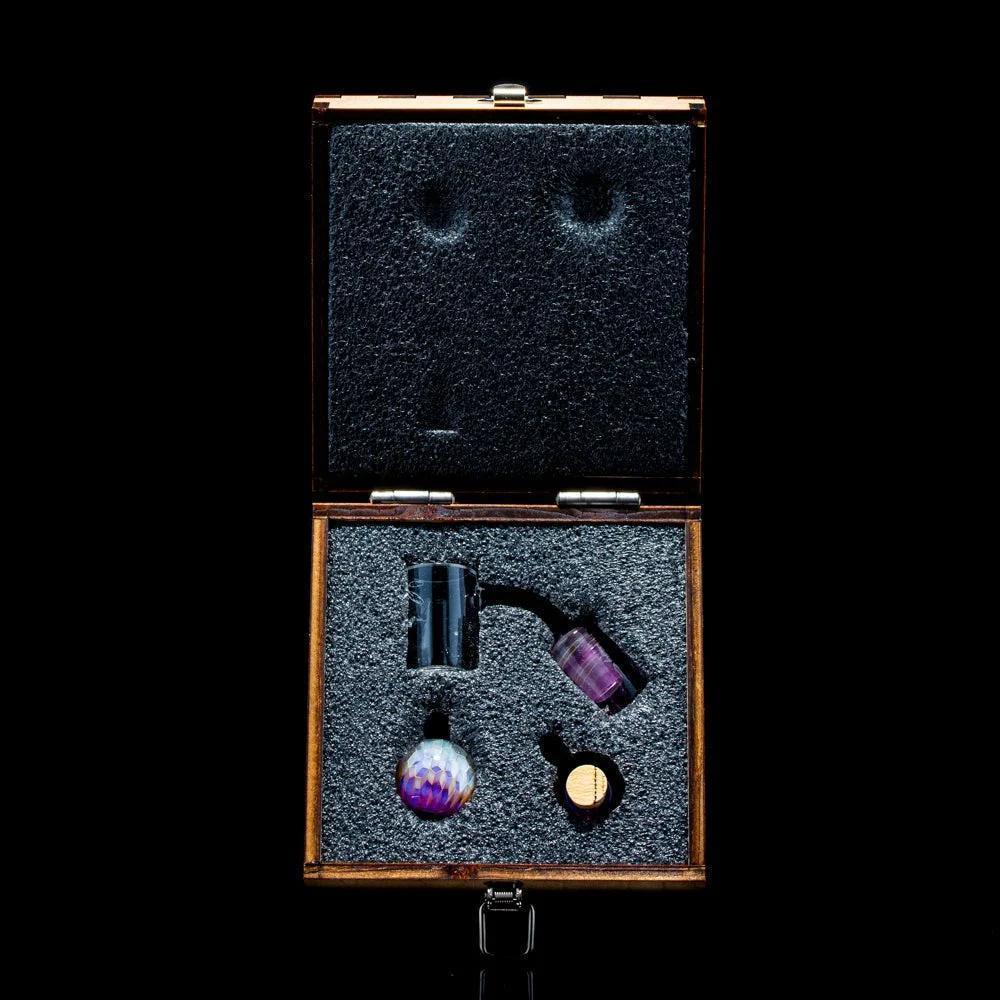 Heady glass quartz banger set with colorful accessories in padded wooden case