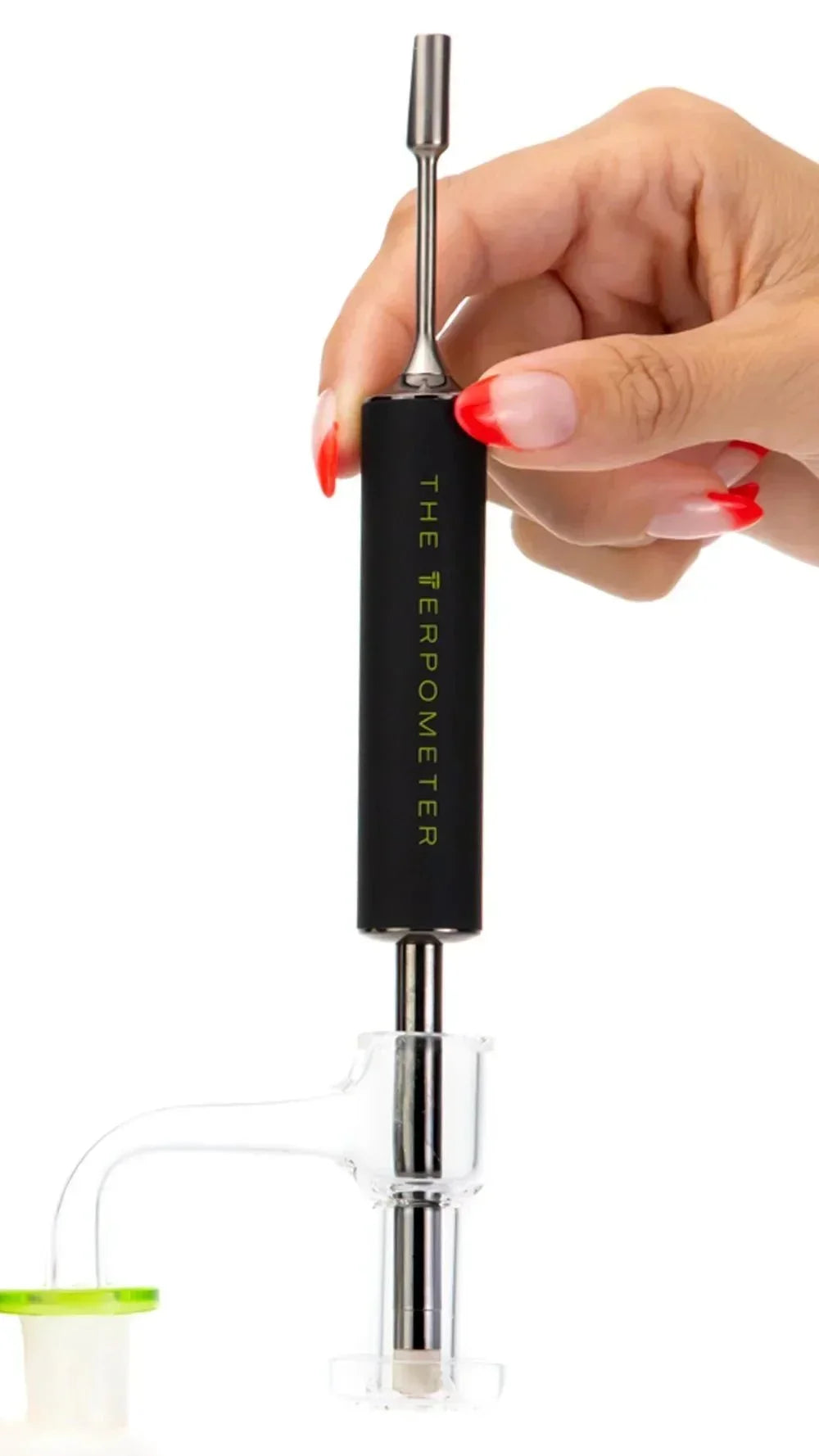 Hand holding XL digital dab thermometer above glass slurper banger for temperature control.