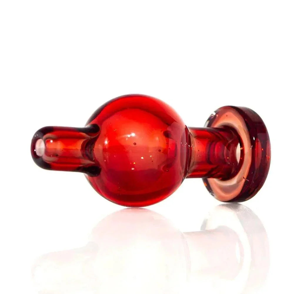 Red glass bubble carb cap for dab rigs, shown on white background