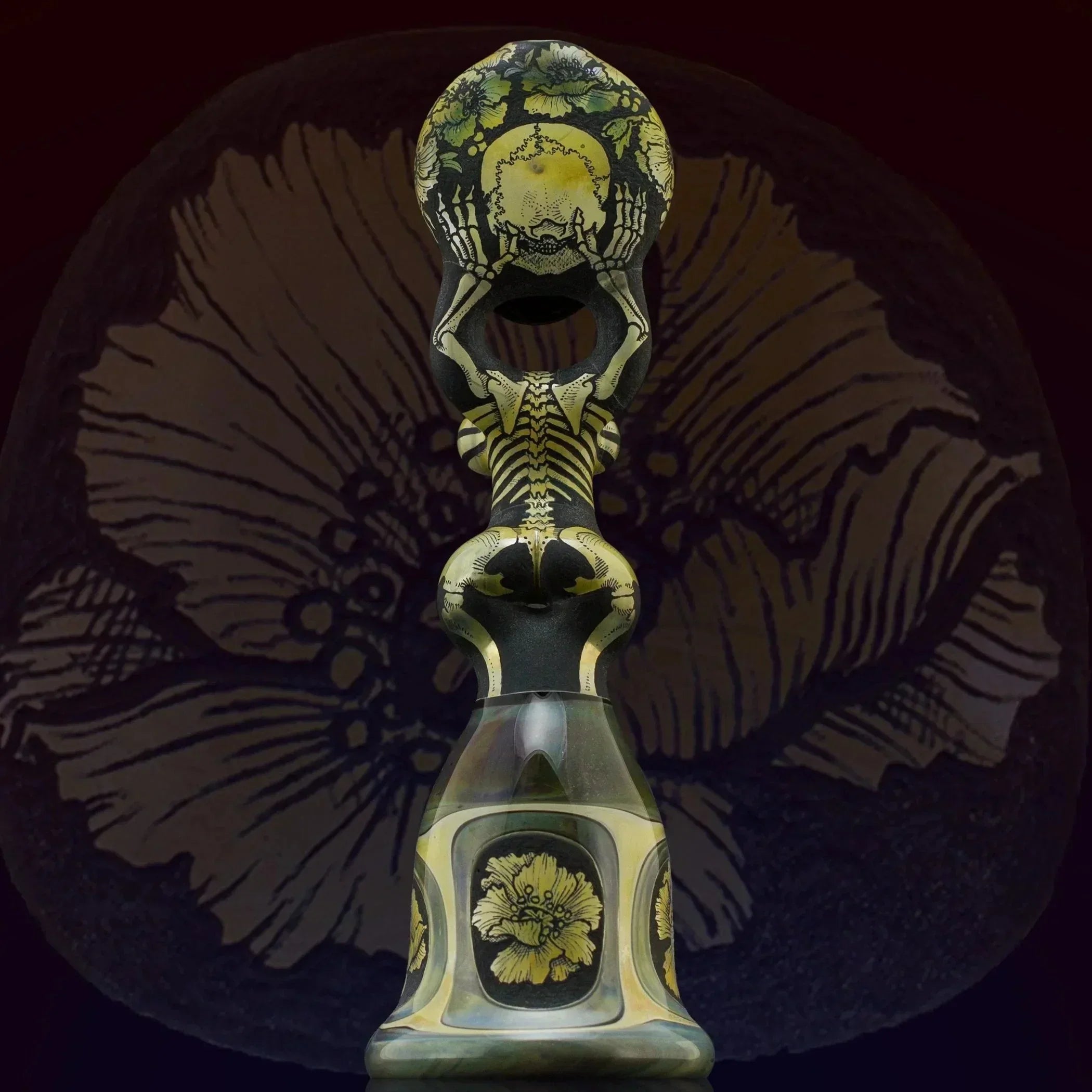 Artistic glass bong with skeleton and floral designs, heady glass piece for collectors