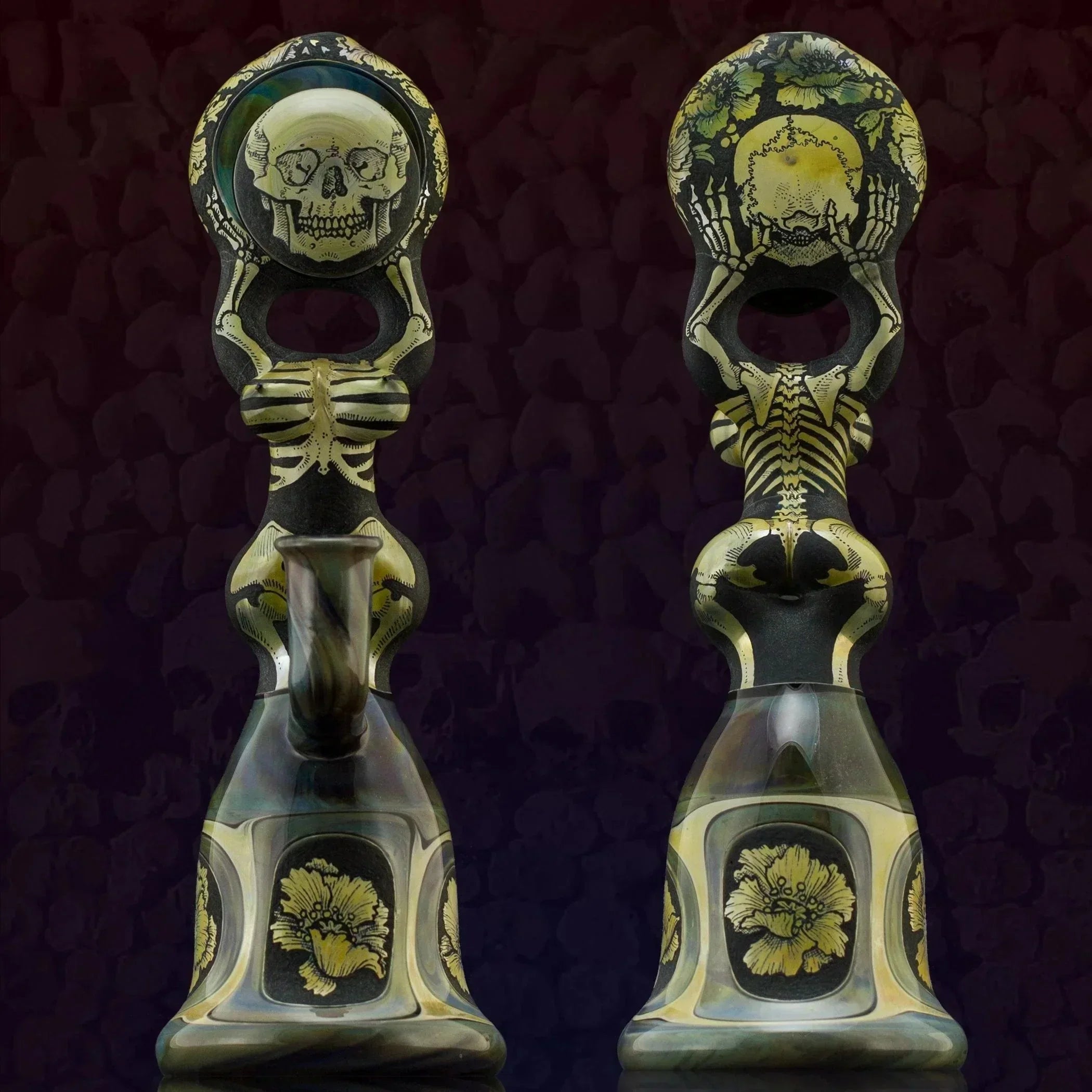 Artistic skeleton-themed glass pipes with floral designs, perfect for heady glass collectors.